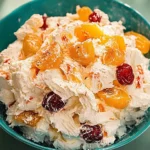 Bowl of colorful Ambrosia Salad with fruit and nuts
