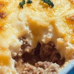Cheddar Bay Ground Beef Cobbler served in a dish with a golden crust