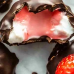Chocolate strawberry frozen yogurt bites in a stylish bowl.
