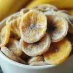 Crispy cinnamon-sugar air fryer banana chips in a bowl
