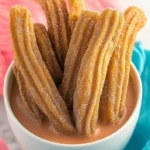 Delicious gluten-free churros served with chocolate dipping sauce