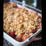 Delicious bowl of Grandma's Rhubarb Crisp dessert with a crunchy topping.