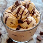 Delicious bowl of homemade no-churn Moose Tracks Ice Cream with chocolate and peanut butter swirls