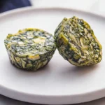 Kale and mushroom egg bites ready to serve in a breakfast bowl