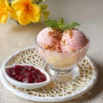 Delicious frozen fruit coconut milk dessert topped with fresh fruits.