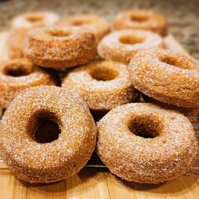 Delicious baked pumpkin donuts decorated with icing and spices