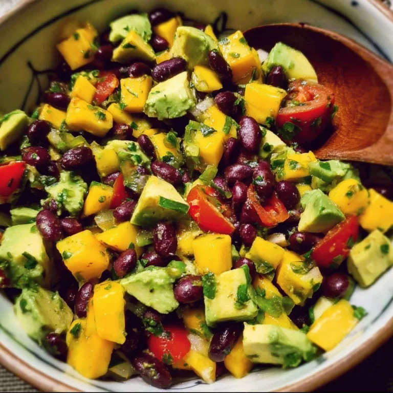 Delicious black bean mango avocado salad served in a bowl