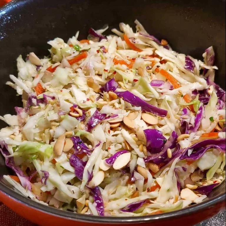 Bowl of Crunchy Coleslaw with Ramen and Almonds garnished