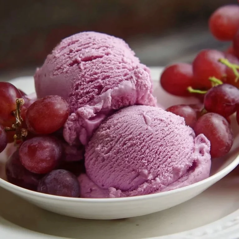 Delicious grape juice ice cream served in a bowl with a spoon