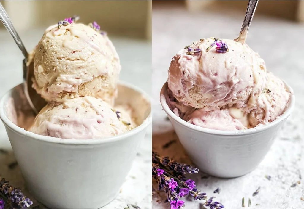 A scoop of honey lavender ice cream in a waffle cone garnished with lavender flowers.