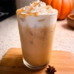 Iced pumpkin cream chai tea latte topped with whipped cream