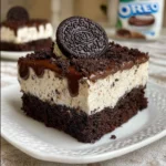 Delicious Oreo Chocolate Cake topped with cookies and cream frosting