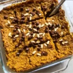 Delicious pumpkin baked oatmeal topped with nuts and served in a bowl