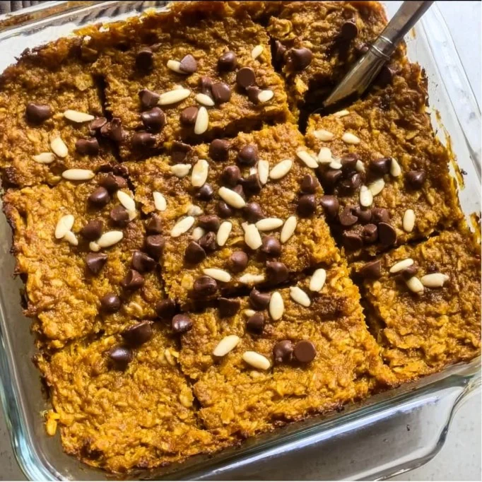 Delicious pumpkin baked oatmeal topped with nuts and served in a bowl
