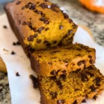 Freshly baked Pumpkin Chocolate Chip Bread with chocolate chips and pumpkin puree