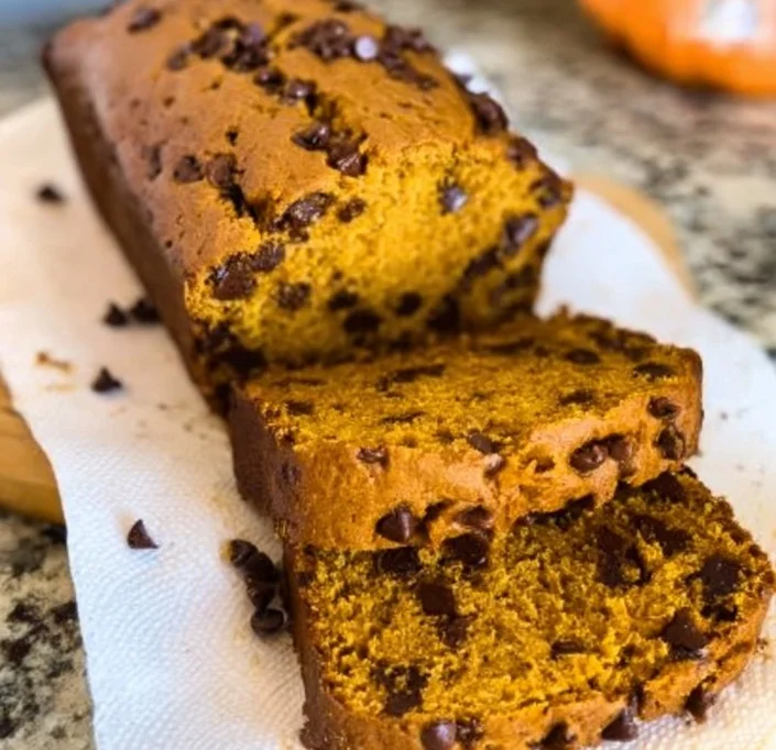 Freshly baked Pumpkin Chocolate Chip Bread with chocolate chips and pumpkin puree