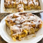 Delicious Pumpkin Cinnamon Roll Casserole topped with icing in a baking dish.