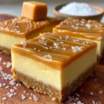 Delicious salted caramel cheesecake bars garnished with caramel drizzle