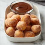 Delicious air fryer churro bites served with chocolate dipping sauce