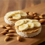 Homemade coconut granola bars stacked on a wooden table