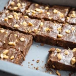 Delicious homemade sweet potato brownies topped with chocolate drizzle.