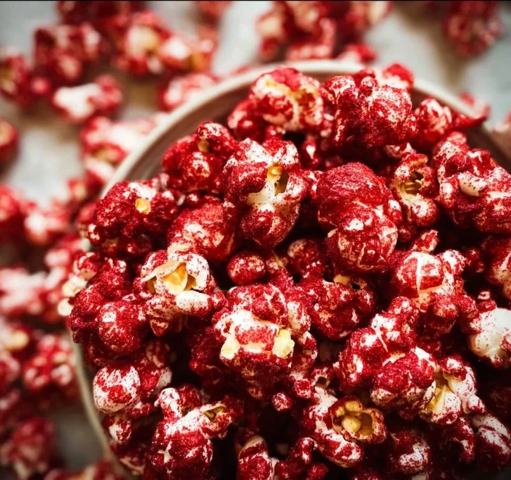 Delicious Red Velvet Popcorn in a decorative bowl, perfect for snacking.