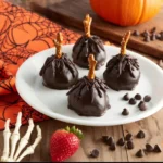 Strawberry chocolate witch brooms decorated for Halloween treats