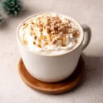 Delicious Caramel Burnt Cream Latte topped with caramel and cream