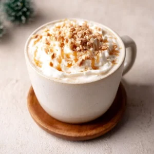Delicious Caramel Burnt Cream Latte topped with caramel and cream