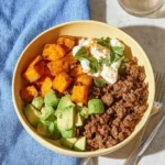 Ground Beef Cottage Cheese Bowl served in a rustic dish with garnishes