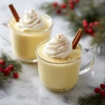 A glass of homemade eggnog topped with nutmeg and cinnamon, perfect for the holidays.