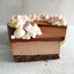 No-Bake Hot Chocolate Cheesecake topped with whipped cream and chocolate shavings