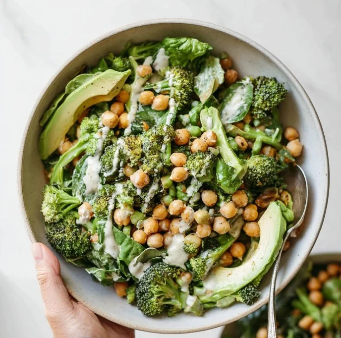Bowl of Simple Green Goodness Chickpea Salad with fresh vegetables and herbs