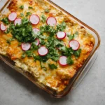 Delicious skinny creamy chicken enchiladas topped with cheese