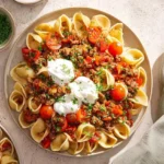 Delicious Turkish pasta dish garnished with herbs and spices