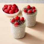 A bowl of delicious Yogurt Chia Pudding topped with fresh fruits and nuts.