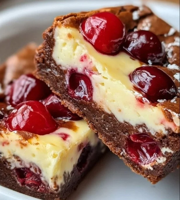 Delicious cherry cheesecake brownies with rich chocolate layers and cherry topping