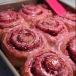 Pink Velvet Cinnamon Rolls topped with cream cheese frosting