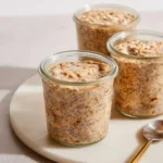 Bowl of brown sugar overnight oats with fresh fruit and nuts for breakfast