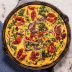 Delicious vegan frittata made with fresh vegetables and plant-based ingredients.