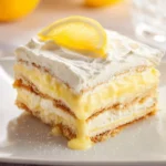 No-bake lemon icebox cake topped with whipped cream and lemon zest