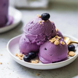 Protein ice cream blueberry cheesecake dessert bowl with fresh blueberries