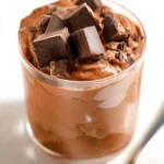 Protein ice cream brownie batter flavor in a bowl with toppings