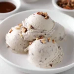 Protein Ice Cream Moose Tracks dessert with chocolate swirls and peanut butter cups