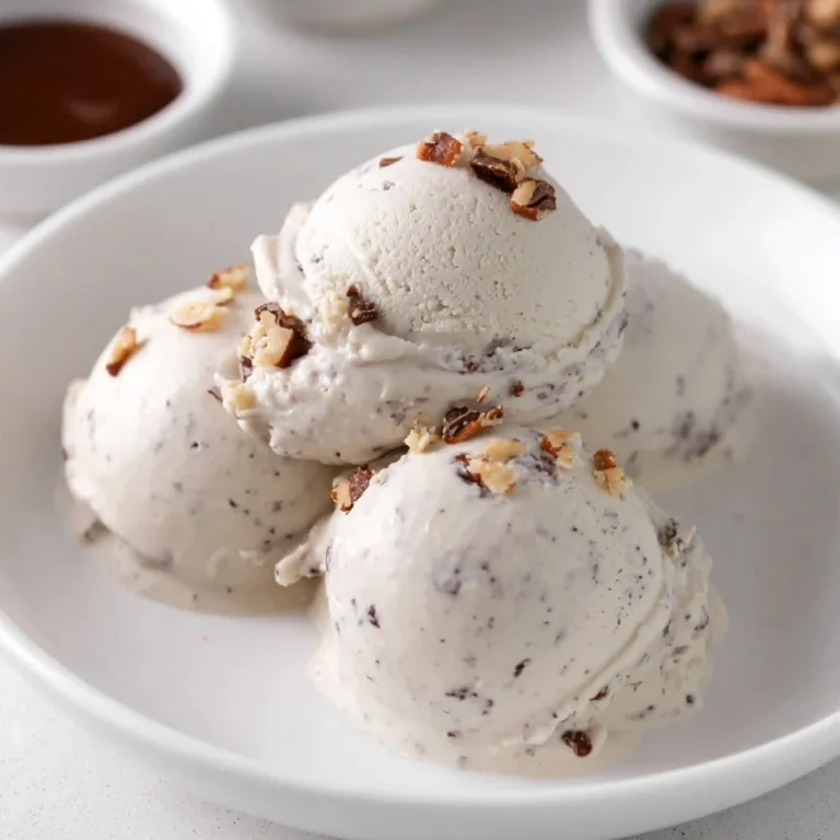 Protein Ice Cream Moose Tracks dessert with chocolate swirls and peanut butter cups