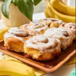 Delicious 5-ingredient banana bread cinnamon rolls topped with cinnamon and sugar.