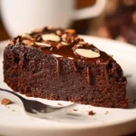 Delicious Almond Flour Chocolate Cake topped with chocolate ganache.