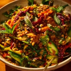 Crispy rice salad with vibrant vegetables and peanut-chili dressing