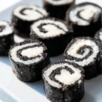 Delicious Oreo Sushi Rolls presented on a plate with colorful toppings.