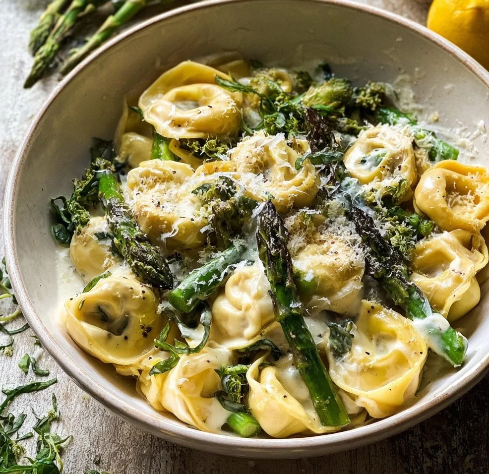 Pasta served with lemon cream sauce and spring vegetables